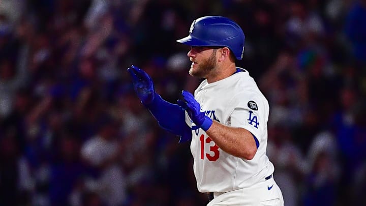 Los Angeles Dodgers third baseman Max Muncy (13) runs the bases after hitting a solo home run against the New York Mets during the ninth inning at Dodger Stadium on June 3.