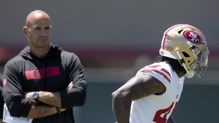 San Francisco 49ers defensive coordinator Robert Saleh (L)