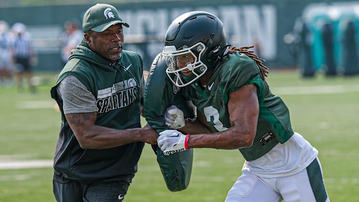 Michigan State's Rodney Bullard Jr. (3) is blocked at a practice with pads at the Michigan State practice field Tuesday, Aug. 5, 2025.