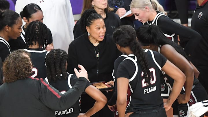 South Carolina Coach Dawn Staley talks with players in a break from playing Clemson during the second quarter at Littlejohn Coliseum Wednesday, November 20, 2024; Clemson, SC, USA.
