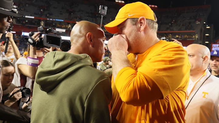 Florida Interim Head Coach Billy Gonzales meets Tennessee head coach Josh Heupel midfield after an NCAA football game against Tennessee at Steve Spurrier Field at Ben Hill Griffin Stadium in Gainesville, FL on Saturday, November 22, 2025. Florida lost to Tennessee 31-11[Alan Youngblood/Gainesville Sun]