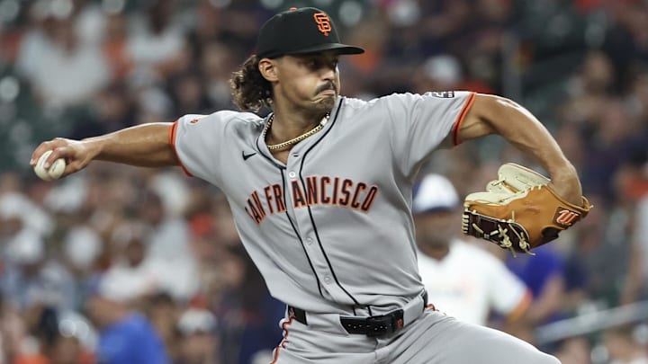 Mar 31, 2025; Houston, Texas, USA; San Francisco Giants starting pitcher Jordan Hicks (12) pitches against the Houston Astros in the first inning  at Daikin Park.