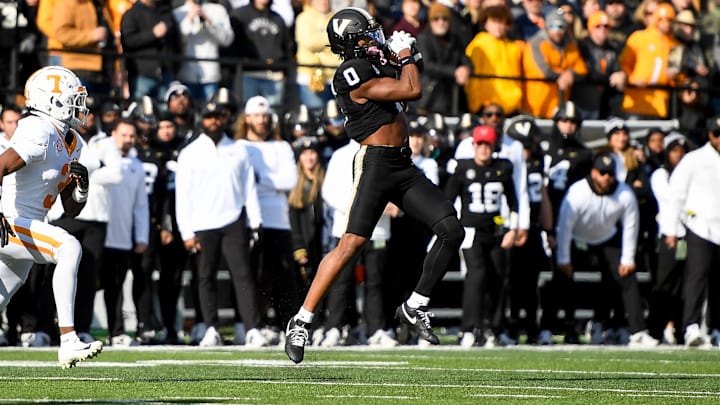 Nov 30, 2024; Nashville, Tennessee, USA;  Vanderbilt Commodores wide receiver Junior Sherrill (0) makes a catch over the middle against the Tennessee Volunteers during the first half at FirstBank Stadium.