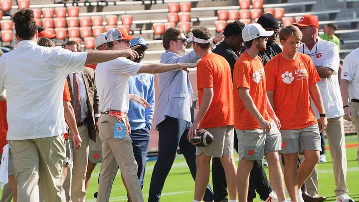 University of North Carolina and Clemson players mix, point fingers, and talk to each other before being separated after  Tiger Walk before the game at Memorial Stadium in Clemson, S.C. Saturday, September 19, 2026.
