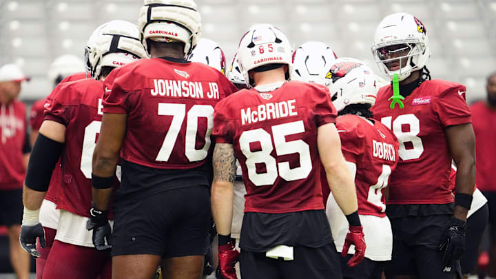 Arizona Cardinals offensive linemen Paris Johnson Jr. (70), tight end Trey McBride (85), and wide receiver Marvin Harrison Jr. (18) during training camp at State Farm Stadium in Glendale on July 25, 2025.