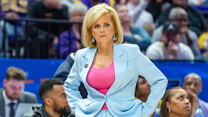 LSU coach Kim Mulkey watches as the defending national champion Tigers hold on for a win against Rice.