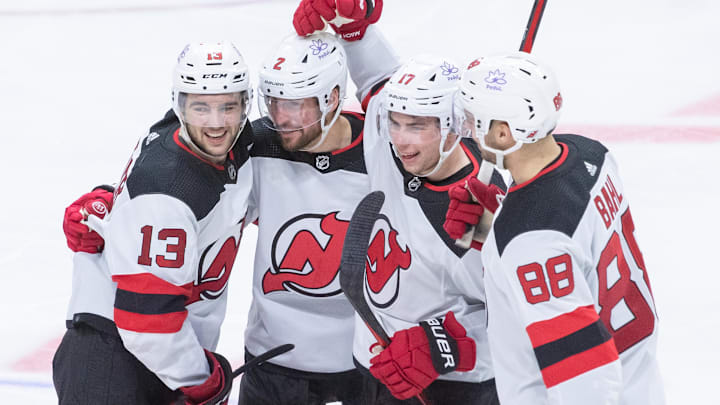 New Jersey Devils defenseman Brendan Smith (2) celebrates with his teammates