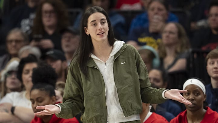 Aug 24, 2025; Minneapolis, Minnesota, USA; Indiana Fever guard Caitlin Clark (22) looks on from the bench against the Minnesota Lynx in the second half at Target Center. Mandatory Credit: Jesse Johnson-Imagn Images
