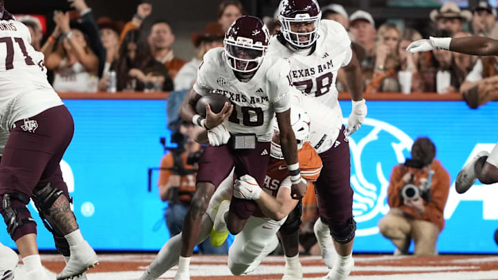 Nov 28, 2025; Austin, Texas, USA; Texas A&M Aggies quarterback Marcel Reed (10) keeps the ball for yards during the first half against the Texas Longhorns at Darrell K Royal-Texas Memorial Stadium. Mandatory Credit: Scott Wachter-Imagn Images Nov 28, 2025; Austin, Texas, USA; Texas A&M Aggies quarterback Marcel Reed (10) keeps the ball for yards during the first half against the Texas Longhorns at Darrell K Royal-Texas Memorial Stadium. Mandatory Credit: Scott Wachter-Imagn Images