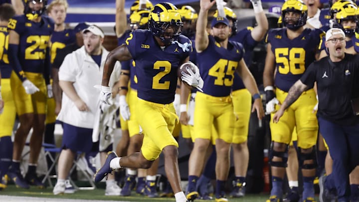 Michigan cornerback Will Johnson races back an interception against Fresno State. Michigan cornerback Will Johnson races back an interception against Fresno State.