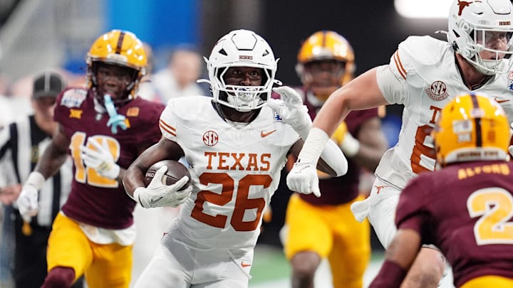 Jan 1, 2025; Atlanta, GA, USA; Texas Longhorns running back Quintrevion Wisner (26) runs with the ball against the Arizona State Sun Devils during the first half of the Peach Bowl at Mercedes-Benz Stadium. Mandatory Credit: Dale Zanine-Imagn Images Jan 1, 2025; Atlanta, GA, USA; Texas Longhorns running back Quintrevion Wisner (26) runs with the ball against the Arizona State Sun Devils during the first half of the Peach Bowl at Mercedes-Benz Stadium. Mandatory Credit: Dale Zanine-Imagn Images