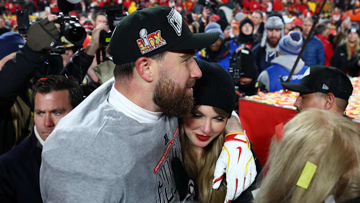 Jan 26, 2025; Kansas City, MO, USA; Recording artist Taylor Swift  and Kansas City Chiefs tight end Travis Kelce (87) react after the AFC Championship game against the Buffalo Bills at GEHA Field at Arrowhead Stadium. 