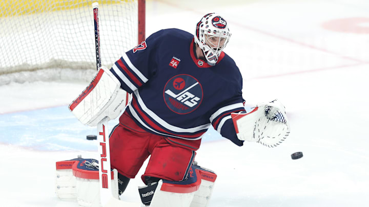 Feb 7, 2025; Winnipeg, Manitoba, CAN; Winnipeg Jets goaltender Connor Hellebuyck (37) warms up before a game against the New York Islanders at Canada Life Centre. Mandatory Credit: James Carey Lauder-Imagn Images