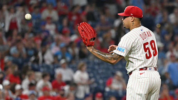 Sep 23, 2025; Philadelphia, Pennsylvania, USA; Philadelphia Phillies pitcher Jhoan Duran (59) gets a new baseball after allowing game-tying home run during the ninth inning against the Miami Marlins at Citizens Bank Park. 