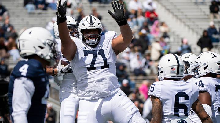 Penn State offensive lineman Vega Ioane (71) celebrates with running back Quinton Martin after the freshman scored a touchdown during the Blue-White game at Beaver Stadium on Saturday, April 13, 2024, in State College. The White team defeated the Blue team, 27-0. Penn State offensive lineman Vega Ioane (71) celebrates with running back Quinton Martin after the freshman scored a touchdown during the Blue-White game at Beaver Stadium on Saturday, April 13, 2024, in State College. The White team defeated the Blue team, 27-0.
