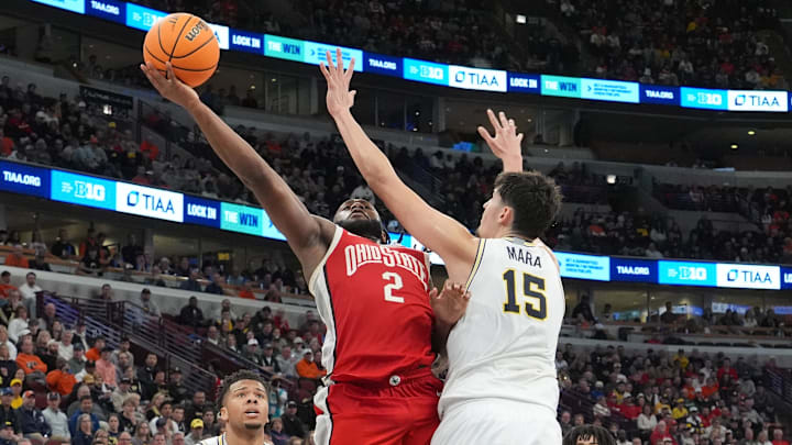Mar 13, 2026; Chicago, IL, USA; Michigan Wolverines center Aday Mara (15) defends Ohio State Buckeyes guard Bruce Thornton (2) during the second half at United Center. Mandatory Credit: David Banks-Imagn Images