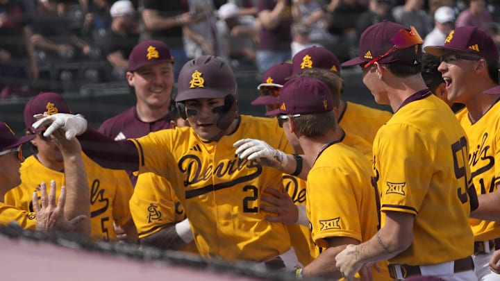 Arizona State catcher Josiah Cromwick (21) is congratulated after a solo home run against Ohio State during the first inning at Phoenix Municipal Stadium on Feb. 16, 2025.