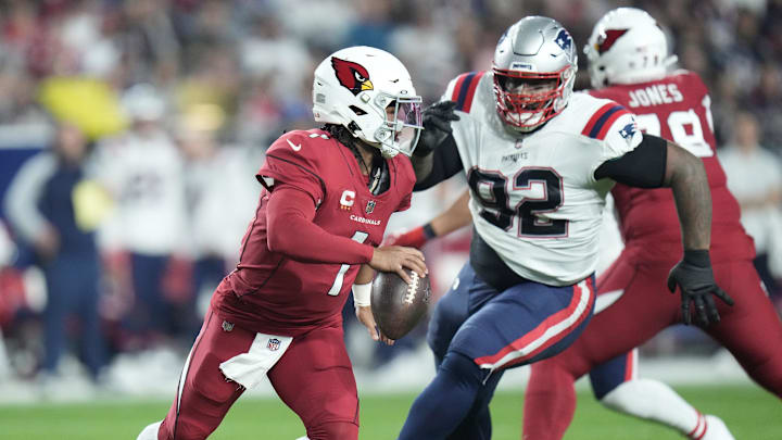 Dec 12, 2022; Glendale, Arizona, USA; Arizona Cardinals quarterback Kyler Murray (1) scrambles away from New England Patriots defensive tackle Davon Godchaux (92) during the first quarter at State Farm Stadium.