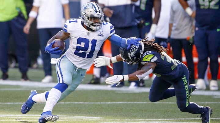 Sep 27, 2020; Seattle, Washington, USA; Dallas Cowboys running back Ezekiel Elliott (21) runs for
