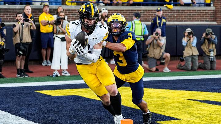 Iowa wide receiver Reece Vander Zee (2) makes a catch for a touchdown against Michigan cornerback Smith Snowden (3) during the second half at Michigan Stadium in Ann Arbor on Saturday, Sept. 26, 2026.