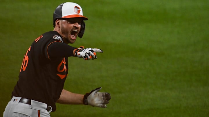 Jul 8, 2022; Baltimore, Maryland, USA; Baltimore Orioles designated hitter Trey Mancini (16) points to the bench after hitting a walk off single in the ninth inning scoring center fielder Cedric Mullins (31) to defeat against the Los Angeles Angels at Oriole Park at Camden Yards. Jul 8, 2022; Baltimore, Maryland, USA; Baltimore Orioles designated hitter Trey Mancini (16) points to the bench after hitting a walk off single in the ninth inning scoring center fielder Cedric Mullins (31) to defeat against the Los Angeles Angels at Oriole Park at Camden Yards.