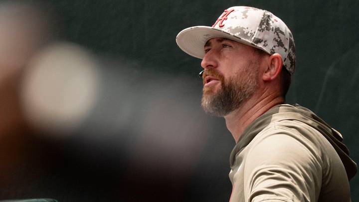 Jun 7, 2026; Tuscaloosa, AL, USA; Alabama head coach Rob Vaughn talks to a friend before Game 2 of the Super Regional between Alabama and St. John's at Sewell-Thomas Stadium.