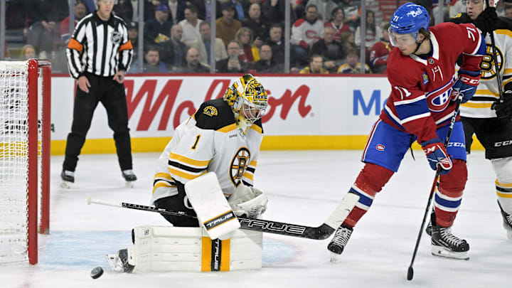 Apr 3, 2025; Montreal, Quebec, CAN; Boston Bruins goalie Jeremy Swayman (1) stops Montreal Canadiens forward Jake Evans (71) during the second period at the Bell Centre. Mandatory Credit: Eric Bolte-Imagn Images