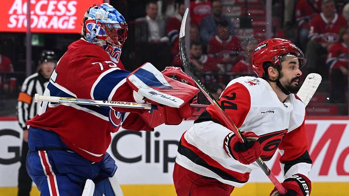 May 27, 2026; Montreal, Quebec, CAN; Montreal Canadiens goaltender Jakub Dobes (75) checks Carolina Hurricanes center Seth Jarvis (24) during the second period in game four of the Eastern Conference Final of the 2026 Stanley Cup Playoffs at Bell Centre. Mandatory Credit: David Kirouac-Imagn Images