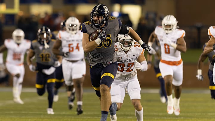Kent State tight end Justin Holmes breaks free for a long run after the catch during Wednesday night   s MAC Conference game against the Bowling Green Falcons in Kent.