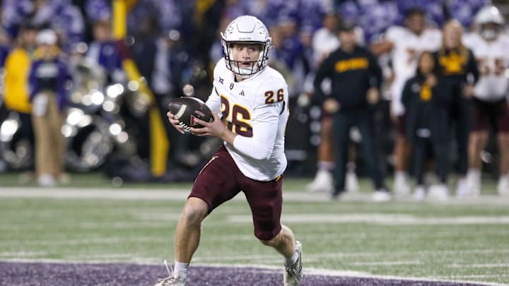 Nov 16, 2024; Manhattan, Kansas, USA; Arizona State Sun Devils holder Carson Kieffer (26) runs the ball on a fake field goal against the Kansas State Wildcats to end the second quarter at Bill Snyder Family Football Stadium. Mandatory Credit: Scott Sewell-Imagn Images