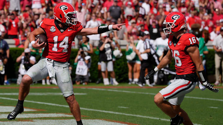 Georgia quarterback Gunner Stockton (14) celebrates with Georgia wide receiver London Humphreys (16) while walking in for a touchdown during the first half of a NCAA college football game against Marshall in Athens, Ga., on Saturday, August. 30, 2025. Georgia quarterback Gunner Stockton (14) celebrates with Georgia wide receiver London Humphreys (16) while walking in for a touchdown during the first half of a NCAA college football game against Marshall in Athens, Ga., on Saturday, August. 30, 2025.