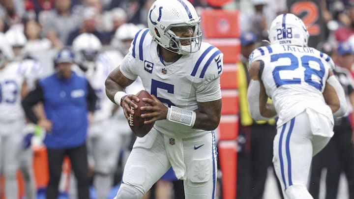 Oct 27, 2024; Houston, Texas, USA; Indianapolis Colts quarterback Anthony Richardson (5) rolls out of the pocket during the first quarter against the Houston Texans at NRG Stadium. Mandatory Credit: Troy Taormina-Imagn Images