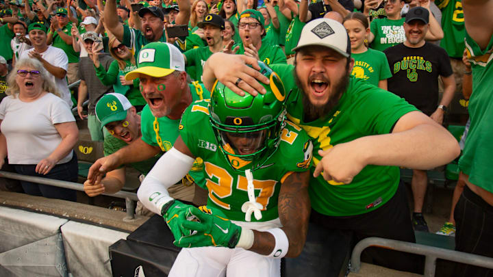 Oregon defensive back Daylen Austin leaps into the stands as the Oregon Ducks host the Boise State Broncos Saturday, Sept. 7, 2024 at Autzen Stadium in Eugene, Ore.