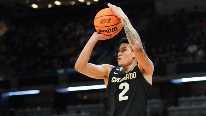 Mar 24, 2024; Indianapolis, IN, USA; Colorado Buffaloes guard KJ Simpson (2) shoots against the Marquette Golden Eagles during the first half at Gainbridge FieldHouse. 
