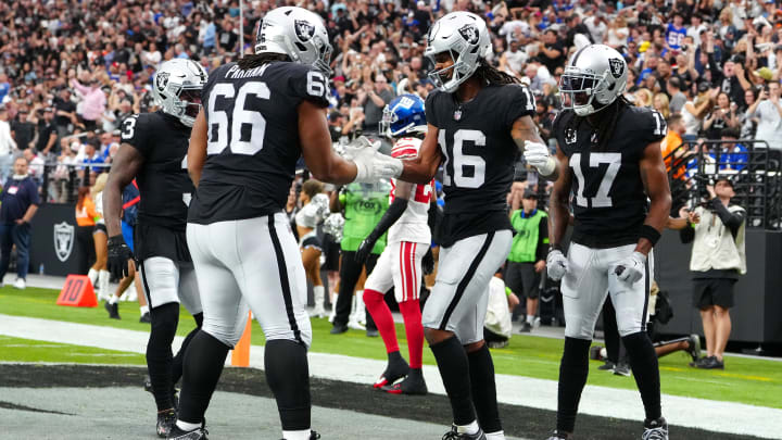 Nov 5, 2023; Paradise, Nevada, USA; Las Vegas Raiders wide receiver Jakobi Meyers (16) celebrates with Las Vegas Raiders guard Dylan Parham (66) after scoring a touchdown against the New York Giants during the first quarter at Allegiant Stadium. Mandatory Credit: Stephen R. Sylvanie-USA TODAY Sports