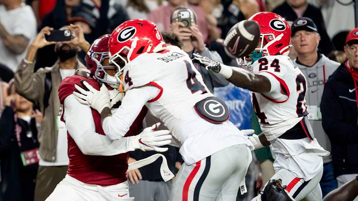 Oct 10, 2026; Tuscaloosa, Alabama, USA;  Georgia defensive back KJ Bolden (4) hits Alabama wide receiver Rico Scott (7) well before the ball arrives at Saban Field at Bryant-Denny Stadium. No penalty was called. Mandatory Credit: Gary Cosby Jr.-Imagn Images