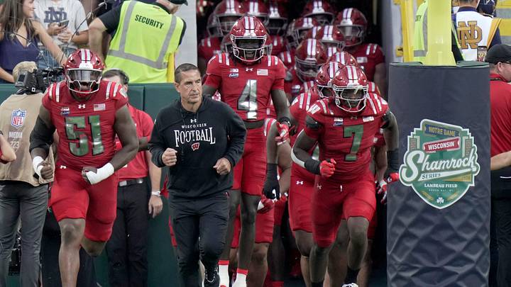 Wisconsin head coach Luke Fickell leads his team to the field before their game against Notre Dame Sunday, September 6, 2026 at Lambeau Field in Green Bay, Wisconsin.