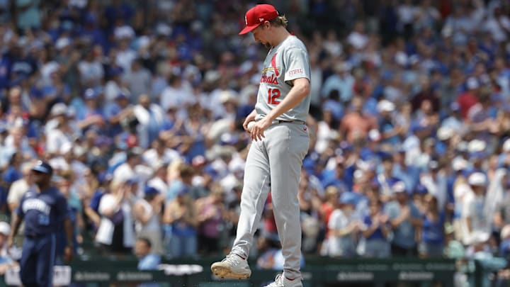 Aug 2, 2024; Chicago, Illinois, USA; St. Louis Cardinals starting pitcher Erick Fedde (12) reacts after giving up a three run home run to Chicago Cubs catcher Christian Bethancourt during the second inning at Wrigley Field. Mandatory Credit: Kamil Krzaczynski-Imagn Images
