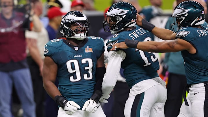 Feb 9, 2025; New Orleans, LA, USA; Philadelphia Eagles defensive tackle Milton Williams (93) celebrates with defensive end Brandon Graham (55) after a play against the Kansas City Chiefs during the first half of Super Bowl LIX at Caesars Superdome. Mandatory Credit: Bill Streicher-Imagn Images