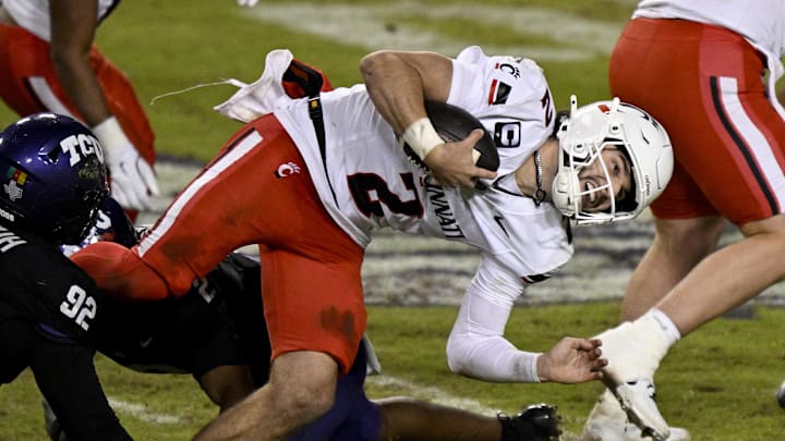 Nov 29, 2025; Fort Worth, Texas, USA; TCU Horned Frogs safety Jamel Johnson (2) tackle Cincinnati Bearcats quarterback Brendan Sorsby (2) during the second half at Amon G. Carter Stadium. Mandatory Credit: Jerome Miron-Imagn Images