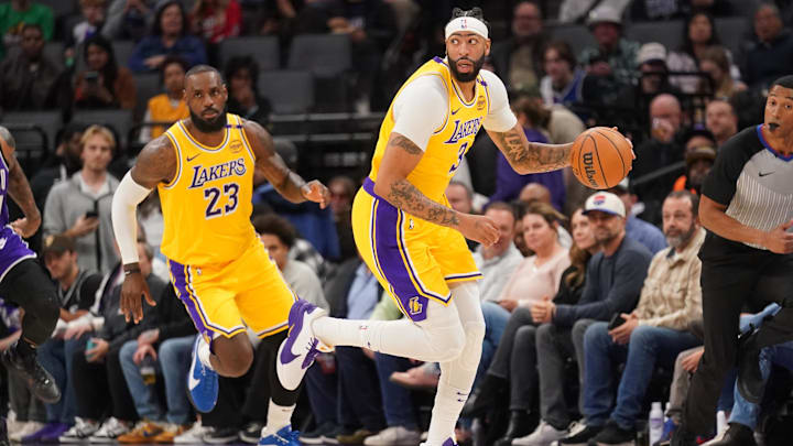 Dec 19, 2024; Sacramento, California, USA; Los Angeles Lakers forward Anthony Davis (3) dribbles the ball next to forward LeBron James (23) against the Sacramento Kings in the first quarter at the Golden 1 Center. Mandatory Credit: Cary Edmondson-Imagn Images