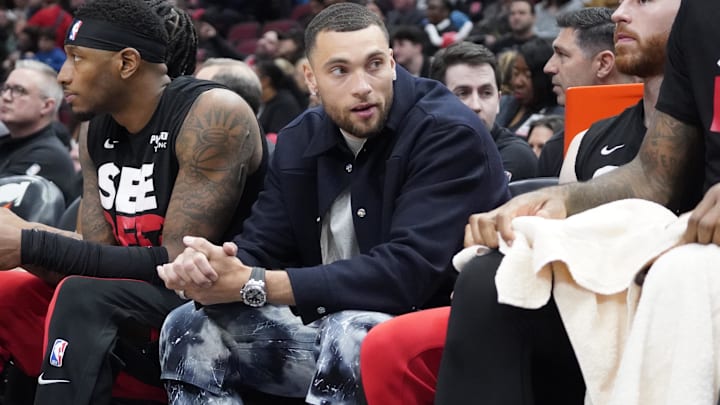Apr 5, 2024; Chicago, Illinois, USA; Chicago Bulls guard Zach LaVine (8) sits on the bench in street clothes during the first quarter at United Center. Mandatory Credit: David Banks-Imagn Images