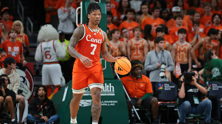 Feb 10, 2026; Coral Gables, Florida, USA; Miami Hurricanes forward Shelton Henderson (7) dribbles the basketball against the North Carolina Tar Heels during the first half at Watsco Center. Mandatory Credit: Sam Navarro-Imagn Images
