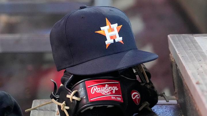 Houston Astros ball cap and glove sits in the dug out. Mandatory Credit: John E. Sokolowski-Imagn Images Houston Astros ball cap and glove sits in the dug out. Mandatory Credit: John E. Sokolowski-Imagn Images