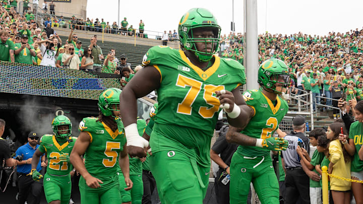 Oregon’s Emmanuel Pregnon, center, takes the field before the game against Oklahoma State at Autzen. Oregon’s Emmanuel Pregnon, center, takes the field before the game against Oklahoma State at Autzen.