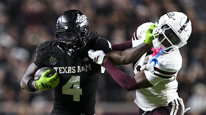 Texas A&M Aggies running back Rueben Owens II (4) stiff arms Mississippi State Bulldogs safety Jahron Manning (13) during the fourth quarter at Kyle Field. Texas A&M Aggies running back Rueben Owens II (4) stiff arms Mississippi State Bulldogs safety Jahron Manning (13) during the fourth quarter at Kyle Field.
