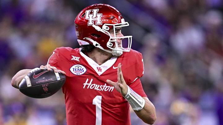 Dec 27, 2025; Houston, TX, USA; Houston Cougars quarterback Conner Weigman (1) looks to pass the ball during the first half against the Louisiana State Tigers at NRG Stadium. Mandatory Credit: Maria Lysaker-Imagn Images 