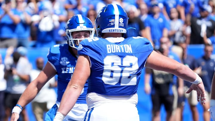 Kentuckyâ€™s quarterback Zach Calzada (5) celebrates with teammate Jager Burton (62) scoring a touchdown against Toledo Saturday afternoon at Kroger Field.
August 30, 2025