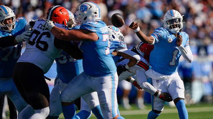Tennessee Titans quarterback Cam Ward (1) is hit while passing on third down during the fourth quarter at Nissan Stadium in Nashville, Tenn., Sunday, Oct. 25, 2026. Tennessee Titans quarterback Cam Ward (1) is hit while passing on third down during the fourth quarter at Nissan Stadium in Nashville, Tenn., Sunday, Oct. 25, 2026.
