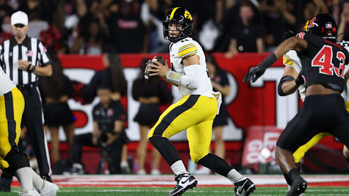 Sep 19, 2025; Piscataway, New Jersey, USA; Iowa Hawkeyes quarterback Mark Gronowski (11) drops back to pass during the first half against the Rutgers Scarlet Knights at SHI Stadium. Mandatory Credit: Vincent Carchietta-Imagn Images